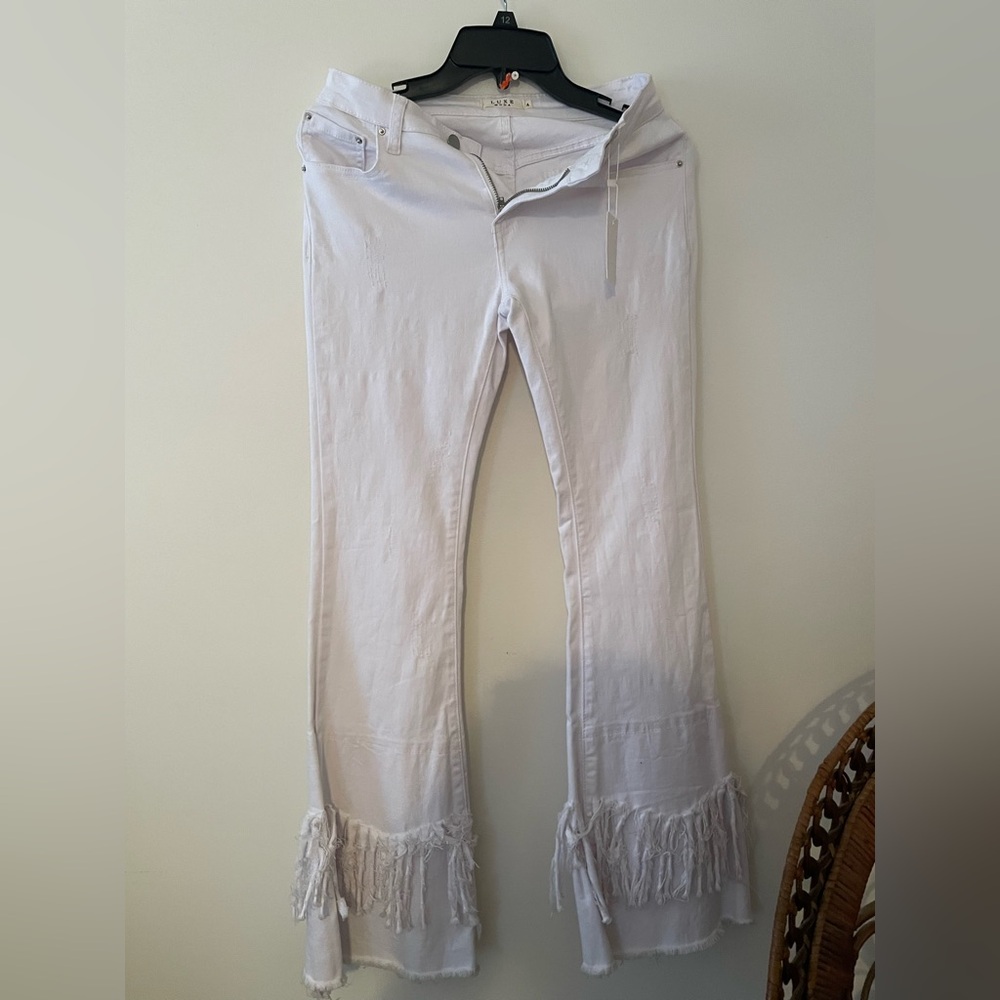 5 for $25 Moda Luxe White Flared Jeans with Fringe Hem.